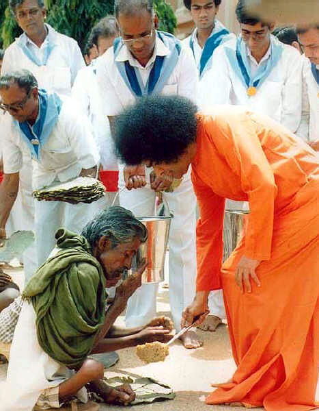 Baba serving food to the poor
